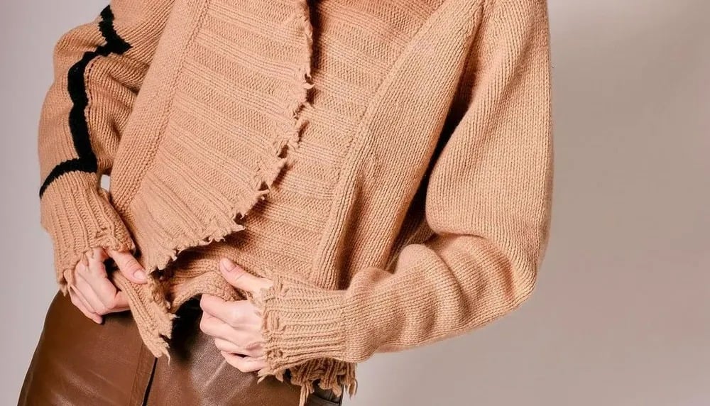 Pull avec des bouloches