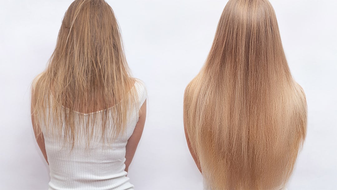 Femme appliquant de l'huile sur ses cheveux