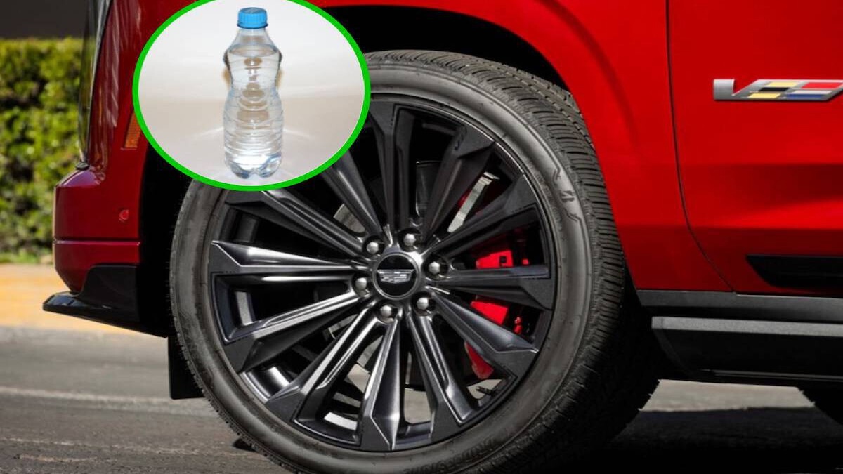 Photo montrant une bouteille coincée entre le pneu et la carrosserie